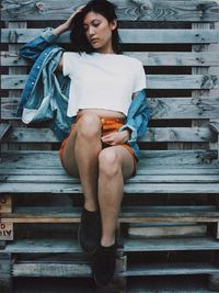 Young woman sitting on steps