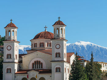 Low angle view of church against clear blue sky