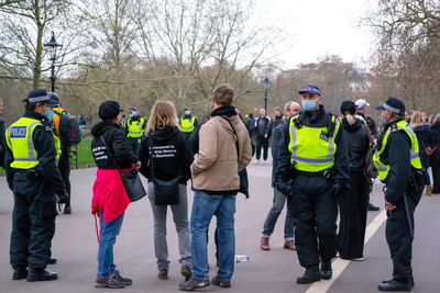 Rear view of people standing in market