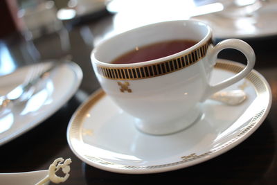 Close-up of coffee cup on table