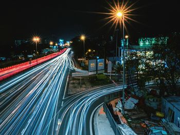 High angle view of light trails on road at night