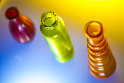 Close-up of colorful glass bottles on table