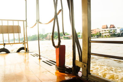 Close-up of boats in sea against sky