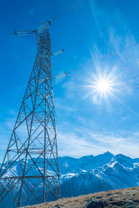 Electricity pylons in a mountain place. origin, transport and need for electricity. eletricity grid.