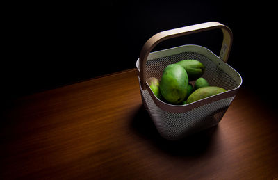 High angle view of fruits in basket on table