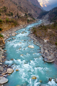 Scenic view of stream flowing through rocks