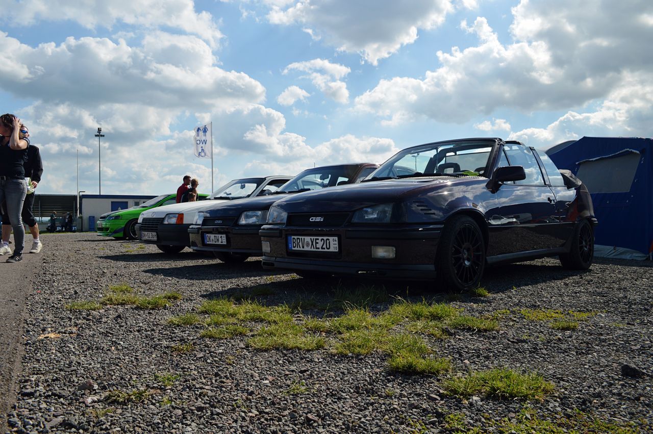 car, cloud - sky, sky, transportation, mode of transport, land vehicle, day, real people, outdoors, stationary, men, nature, people