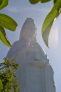 Low angle view of statue against sky