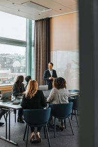Businessman discussing with colleagues in meeting at office