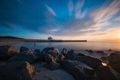 Scenic view of sea against sky at sunset