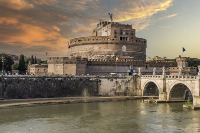 Tevere river and castle sant'angelo in rome at sunset