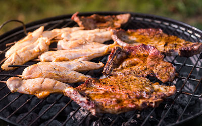 Close-up of meat on barbecue grill