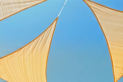 Low angle view of tent against clear blue sky