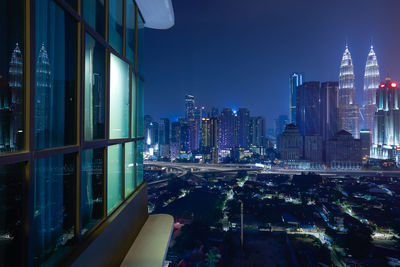 Illuminated buildings in city at night