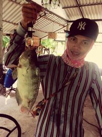 Portrait of man holding fish