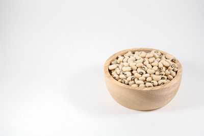 High angle view of ice cream in bowl against white background