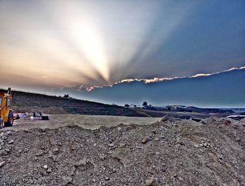 Scenic view of beach against sky during sunset