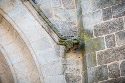 Low angle view of a sculpture on wall