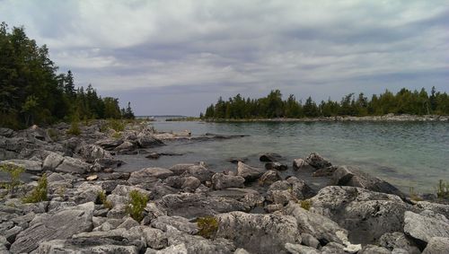 Scenic view of sea against cloudy sky