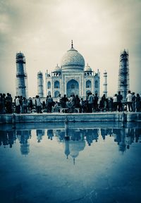 View of tourist standing in front of historic building