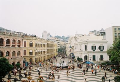 People walking in front of buildings