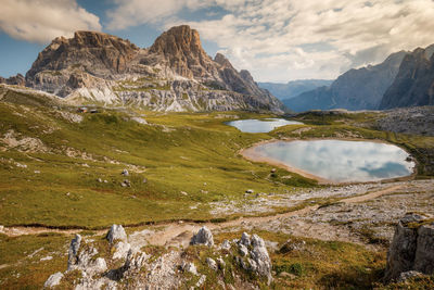 Scenic view of lake and mountains against sky