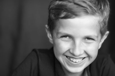 Close-up portrait of smiling young man