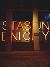 Information sign on road at night