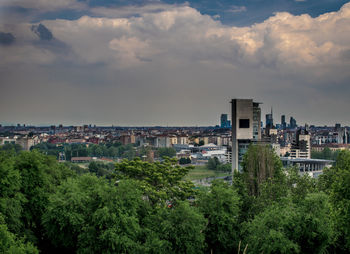High angle view of trees and buildings against sky