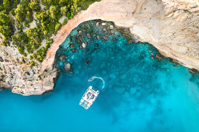Aerial view of catamaran in bay on greek island