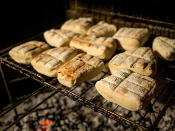 High angle view of meat on barbecue grill