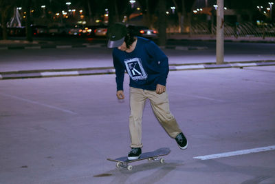 Full length of man skateboarding on skateboard