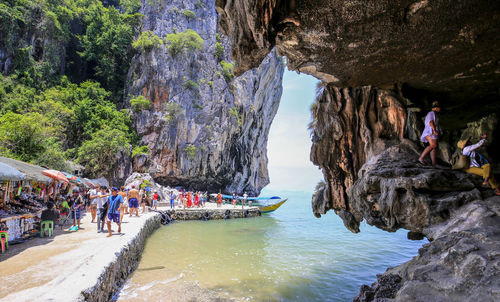 People by cave at beach