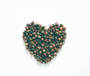 Directly above shot of heart shape on white background