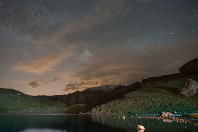 Scenic view of mountains against sky at night