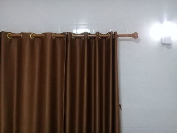 Close-up of illuminated lighting equipment at home