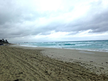 Scenic view of beach against sky