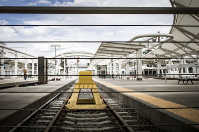 Close-up of cables at union station against cloudy sky