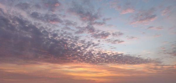 Low angle view of dramatic sky during sunset