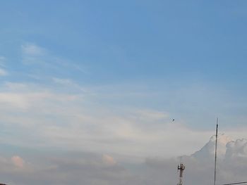 Low angle view of communications tower against sky