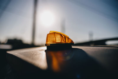 Orange taxi light on roof.