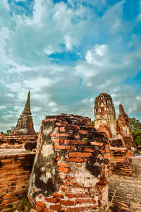 Old temple against cloudy sky