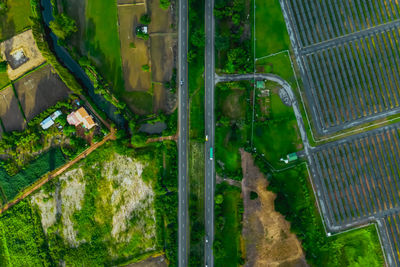 Aerial view of road amidst land