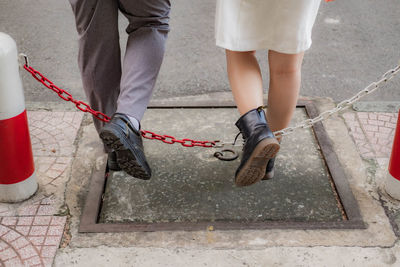 Couple step over obstacle