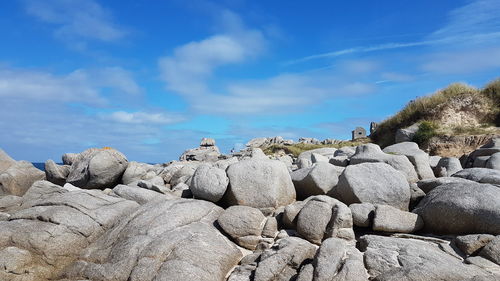 Rocks on rock against sky