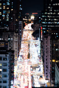 High angle view of illuminated buildings in city at night