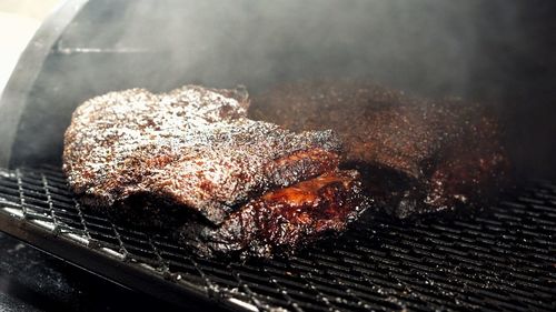 Close-up of meat on barbecue grill