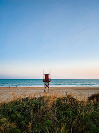 Scenic view of sea against clear blue sky