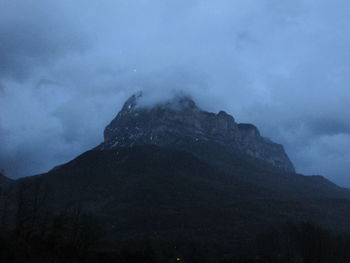 Low angle view of mountain against sky at night