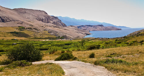 Scenic view of landscape and mountains against sky